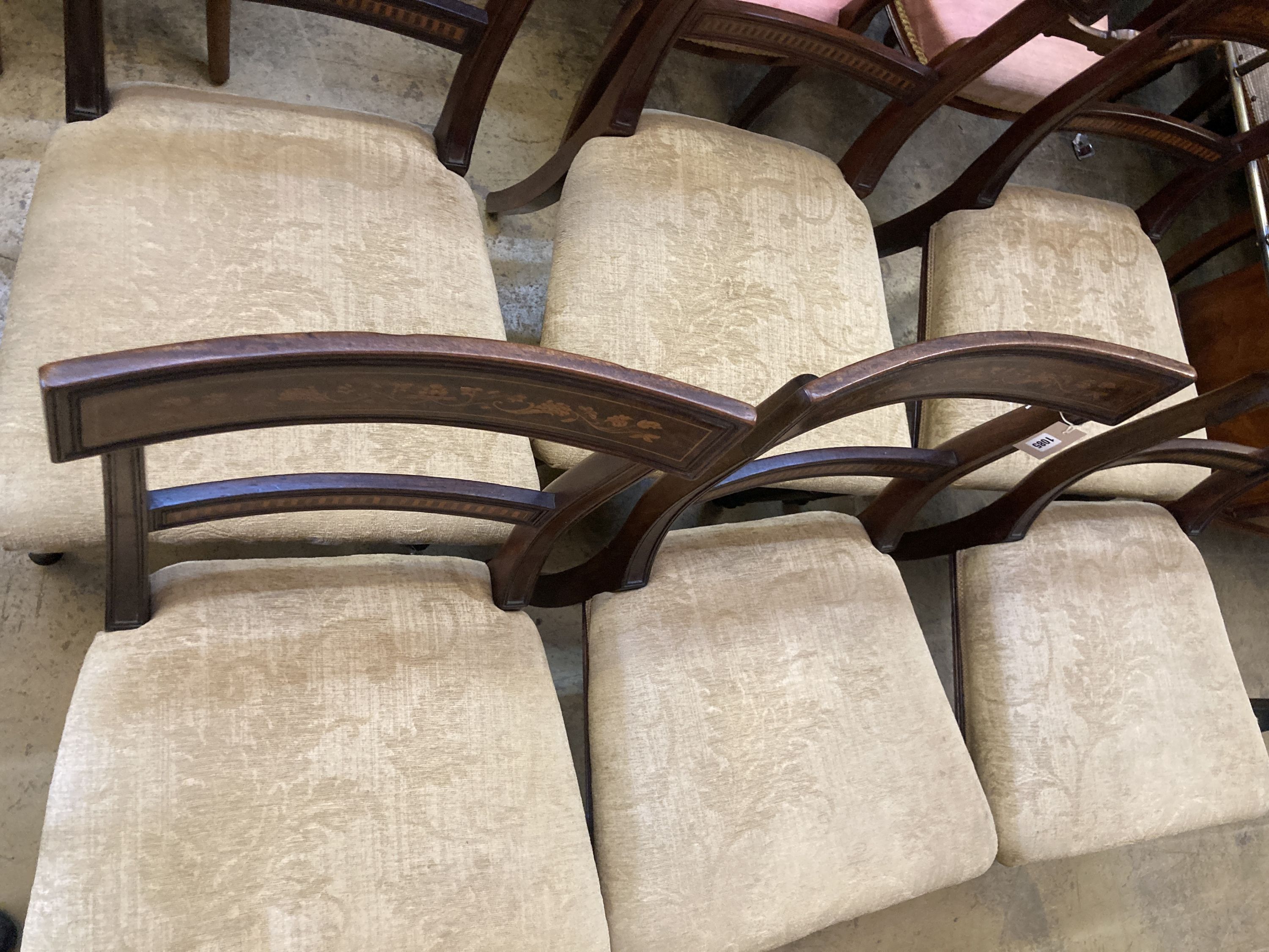 A set of six 19th century Dutch marquetry inlaid mahogany dining chairs